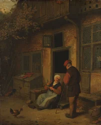 Eine Frau, die vor ihrem Haus Heringe ausnimmt