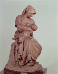 Bäuerin stillt ein Kind