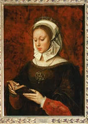 Junge Frau liest ein Stundenbuch