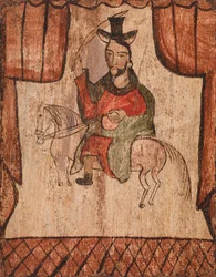 Figur auf einem Pferd reitend