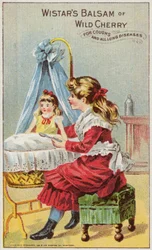 Mädchen gibt ihrer Puppe Medizin