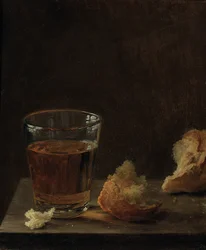 Ein Glas Bier und ein Brötchen auf einem Tisch