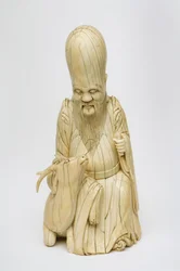 Geschnitzte Elfenbeinfigur von Shou Xing, sitzend mit Hirsch, ca. 1580-1644