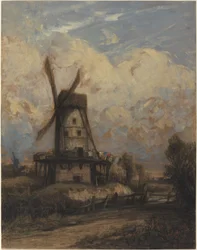 Eine Windmühle vor einem bewölkten Himmel