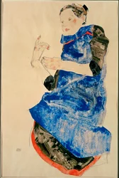 Mädchen in blauer Schürze