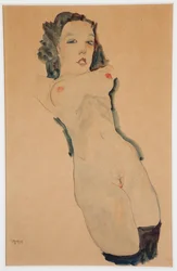 Liegender Akt mit schwarzen Strümpfen