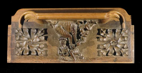 Eine Miserikordie, die eine kleine Figur mit Kappe zeigt, die von einem Monster angegriffen wird, New College Chapel, Oxford, spätes 14. Jahrhundert