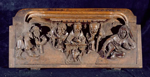 Eine Miserikordie, die einen Akademiker zeigt, der an einem Pult einem knienden Büßer eine Ermahnung erteilt, New College Chapel, Oxford, spätes 14. Jahrhundert