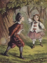 Junge und Mädchen spielen mit Schläger und Ball