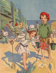 Kinder bauen eine Sandburg