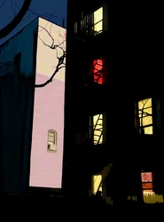 Bunte Fenster von Wohngebäuden bei Nacht