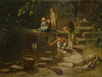 Junge segelt ein kleines Boot