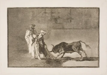 Die Mohren in der Arena bemühen sich, den Stier mithilfe ihrer Burnusse anzulocken