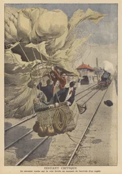 Ein Ballon landet auf einer Eisenbahnlinie vor einem herannahenden Schnellzug