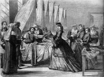 Österreichisch-Preußischer Krieg (1866): Kaiserin Elisabeth von Österreich (Sissi) (1837-1898) besucht verwundete Soldaten in Wien. Gravur in 