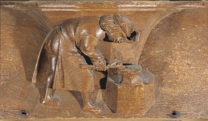 Schnitzerei eines Kupferschmieds, aus einem Chorgestühl