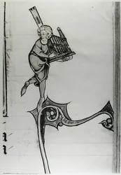 Musiker spielt eine tragbare Orgel, aus der Geschichte von Merlin