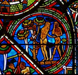 Fenster w15 zeigt das Fenster des barmherzigen Samariters: Adam und Eva essen die verbotene Frucht