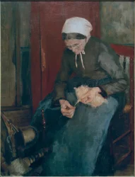Alte Frau beim Spinnen