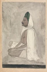 Mann mit grünem Turban, im Schneidersitz