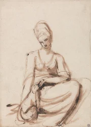 Sitzende Frau, die ein Tier füttert