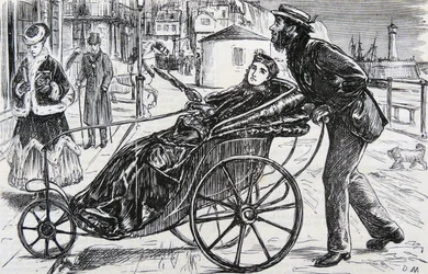 Patrick schiebt den Badestuhl der Dame