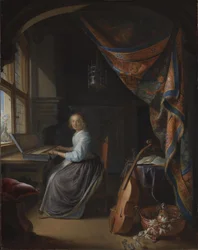 Eine Dame spielt ein Clavichord