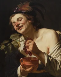 Lächelnder junger Mann, der Trauben presst, 1622
