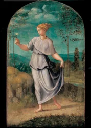Junge Frau mit Blume vor einer weiten Landschaft