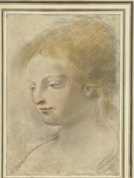 Kopf einer jungen Frau, mit gesenktem Blick