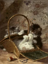 Junge Katzen mit einem Nähkorb