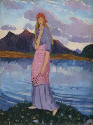 Mädchen steht an einem See