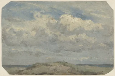 Dünenkuppe mit Meer im Hintergrund