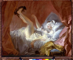 Die Gimblette. Die Gimblette ist ein ringförmiges Gebäck. Das Mädchen spielt auf ihrem Bett liegend mit einem Hund, indem es ihm dieses Gebäck reicht. Paris, Fonds Cailleux