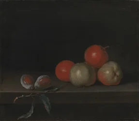 Äpfel und Pfirsiche auf einem Tisch