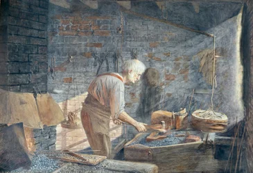 Ein Schmied bei der Arbeit an seiner Schmiede
