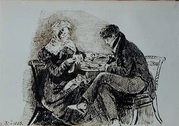 Mann und Frau lesen an einem Tisch