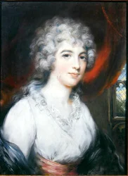 Dame sitzt in einer gotischen Kammer