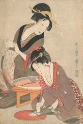 Frauen bereiten Sashimi zu