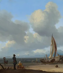 Zeegezicht met figuren bij een vissersboot op het strand
