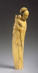 Figur von Guanyin, die ein Kind hält
