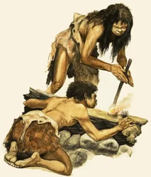 Eine Mutter und ein Kind aus der Steinzeit machen ein Feuer