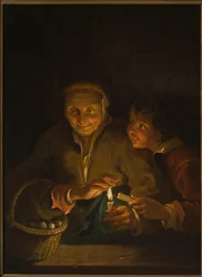 Alte Frau und Junge mit einer Kerze