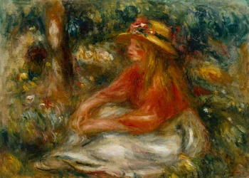 Junge Frau sitzt auf dem Gras