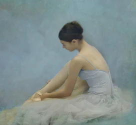 Ballerina bindet Spitzenschuhe