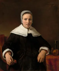Eine Frau, die eine Nelke hält