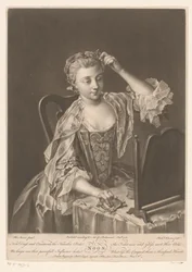 Junge Frau vor ihrem Toilettentisch