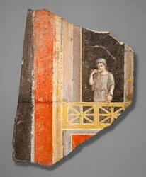 Fragment einer Frau auf einem Balkon