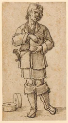 Ein junger Bauer hält einen Krug