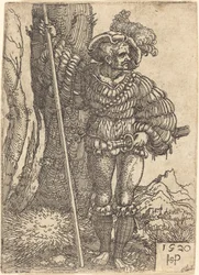 Fußsoldat, der an einem Baum steht